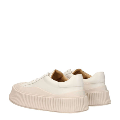 Jil Sander Beige Leather Platform Sneakers with wedge heel, rubber sole, aged effect, and lace-up closure, viewed from rear angle.