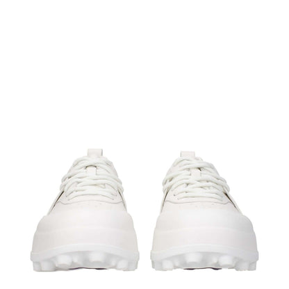 Jil Sander White Leather Sneakers with lace-up closure, rubber sole, mid heels, and round toe design. Sporty glam style.