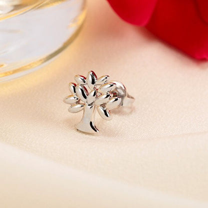 Silver tree charm from LA PETITE STORY JEWELRY Mod. LPS02ARQ09 on a soft background.