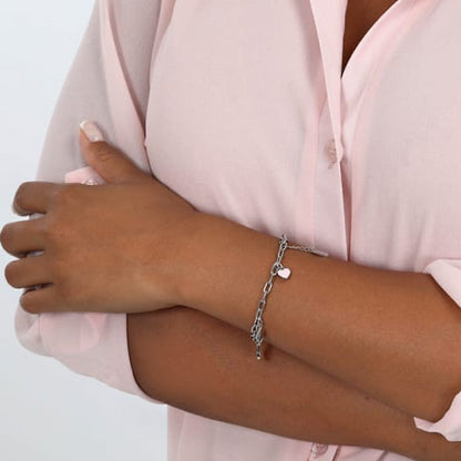 Woman wearing LA PETITE STORY JEWELRY Mod. LPS05ASF56 bracelet on wrist, showcasing elegant and modern style on a pink blouse sleeve.