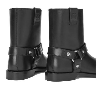 Back view of Loewe Black Calfskin Ankle Boots featuring hardware details and Loewe Anagram embossed loops, made in Italy.