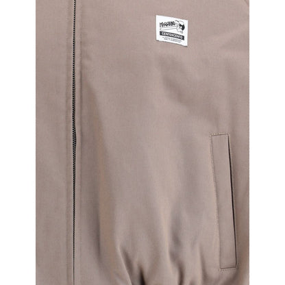 Magliano Bicolor Cotton Full-Length Jacket with logo patch, classic collar, front zipper, and side welt pocket detail.