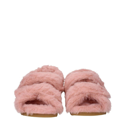 Max Mara Pink Fur Sandals with strap closure, open toe, and low flat heel, made from eco fur and rubber sole, side logo in blush pink.