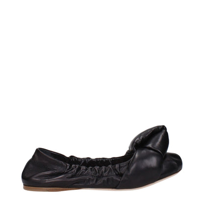 Miu Miu Black Leather Ballet Flats with round toe and low, flat heel. Casual style with leather sole and front detail.