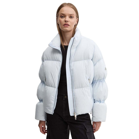 Woman wearing Moose Knuckles Light Blue Nylon Women Jacket with down padding and drawstring sleeves, stylish winter outerwear.