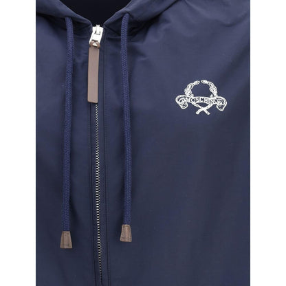 Close-up of Moschino Blue Polyester Shell Jacket with a hood, zipper closure, logo detail, elasticized hem and cuffs for waterproof protection.