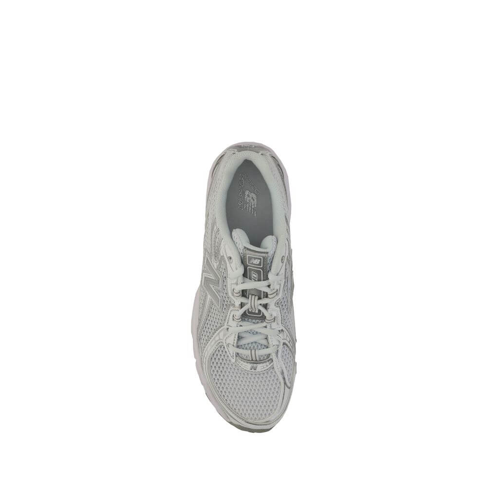 Top view of New Balance White Polyurethane Athletic Sneakers with mesh details, lace-up closure, and rubber sole.