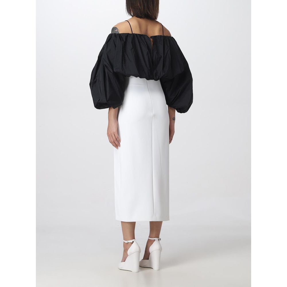 Back view of PINKO White Polyester Midi Skirt with thigh slit, size 42, styled with black off-shoulder top and white heels.