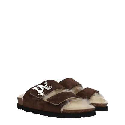 Palm Angels Brown Leather Slippers with open toe, suede material, and strap closure, featuring a front logo and low rubber sole.