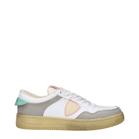 Philippe Model White Leather Low Top Sneakers with teal accents, featuring vintage and aged effects, side logo, and rubber sole.