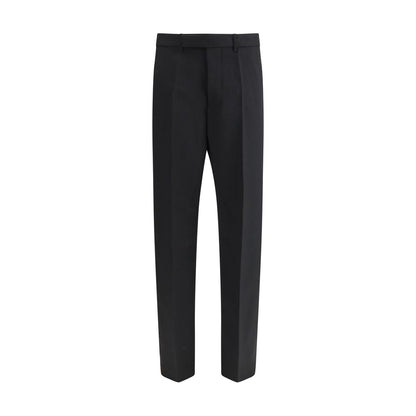 Rick Owens Black Fleece Wool Dress Pants with mid-rise, loose fit, and tailored waistband, featuring ironed pleats and back welt pockets.