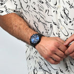 SECTOR Mod. OVERSIZE wristwatch on gentleman's wrist, 48mm stainless steel case, 10 ATM water resistance, silver chronograph watch.
