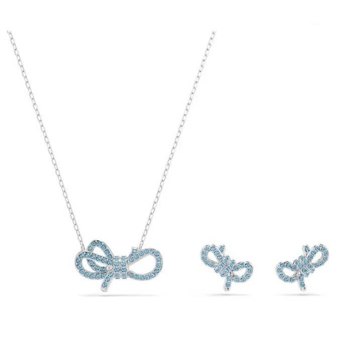 SWAROVSKI Mod. 5723554 Lifelong Bow Set with blue crystals and rhodium plating, includes necklace and earrings in bow design.