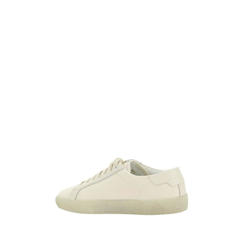 Saint Laurent White Rubber Low Top Sneakers with embroidered brand signature and crater-effect sole, side view.