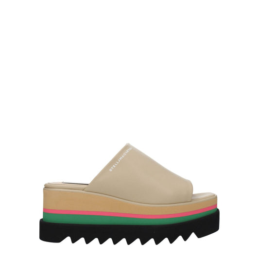 Stella McCartney Beige Leather Slippers with open toe and wedge heel, featuring side logo and eco-friendly materials.