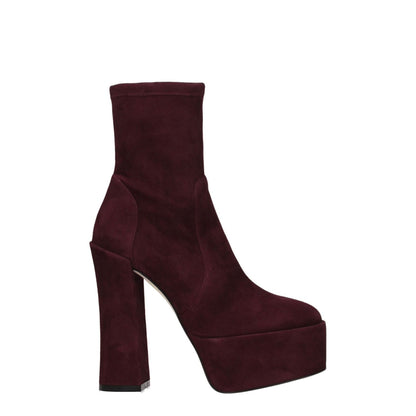 Stuart Weitzman Purple Leather Ankle Boots with high heel, suede material, and round toe design showcasing elegant purple suede finish.