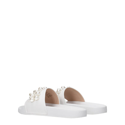 Stuart Weitzman White Leather Slippers with pearl detailing, featuring open toe and rubber sole for a stylish streetwear look.