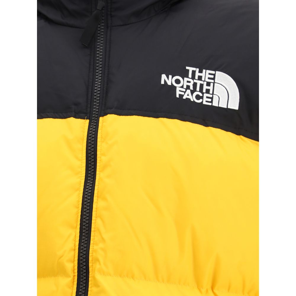 The North Face Yellow Polyamide Shell Jacket close-up with logo and zip detail, showcasing urban street style and functional design.