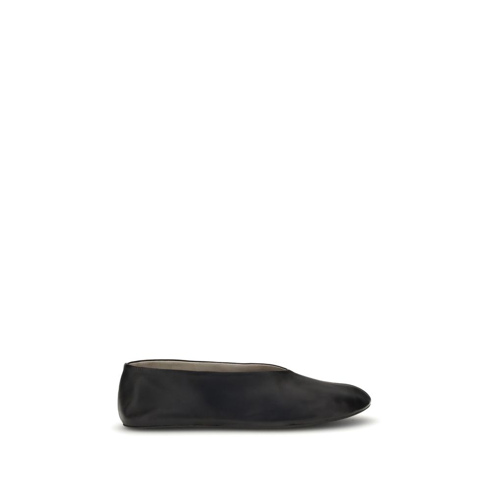 The Row Black Lamb Ovis Aries Aries Ballet Flats in fine grained nappa leather with tapered toe, featuring minimalistic design and logo.