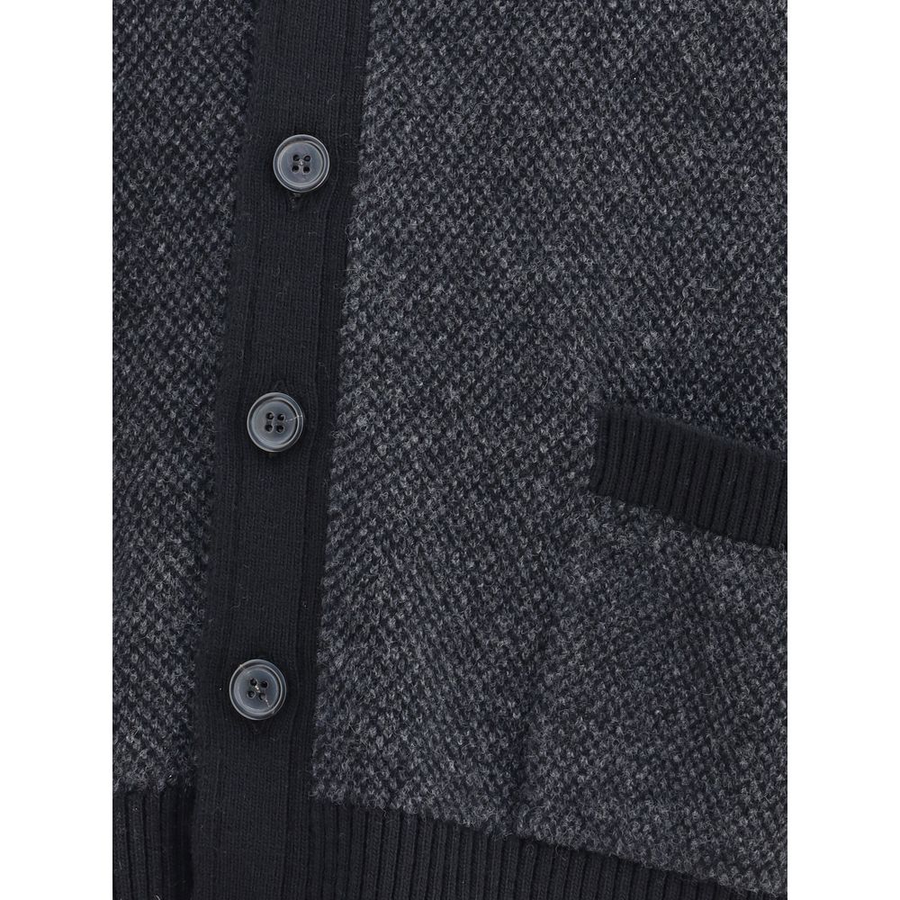 Close-up of Thom Browne Black Fleece Wool Cardigan with buttons and pocket detail, showcasing textured wool fabric and ribbed finish.