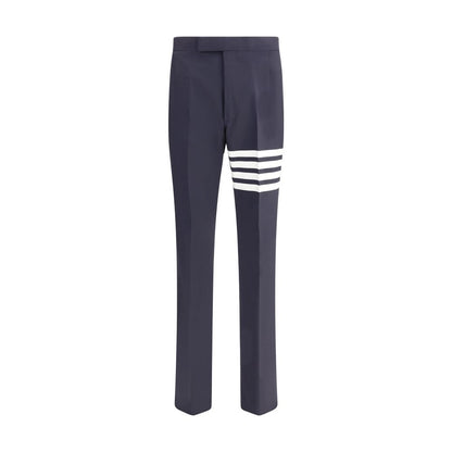 Thom Browne Blue Wool Dress Pants with iconic bands and embossed buttons for formal elegance.