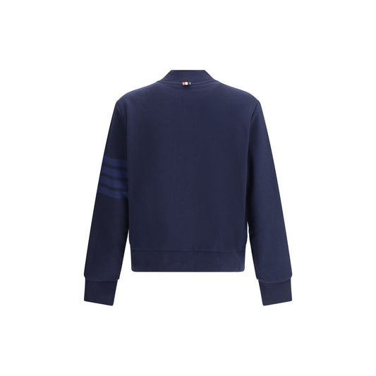 Back view of Thom Browne Zip Sweatshirt in navy, featuring iconic contrasting horizontal bands on left sleeve, 100% cotton.