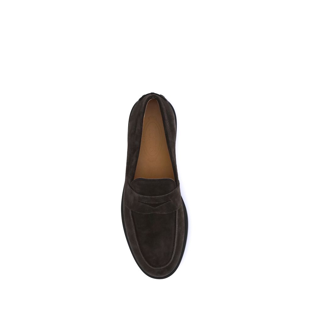 Top view of Tod's Brown Calf Leather Bos Taurus Slip-On Loafers, featuring classic vamp and rubber pebbles on heel, elegant Italian design.