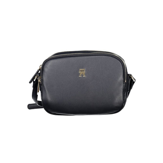 Alt Tag: Tommy Hilfiger Blue Polyester Handbag with adjustable shoulder strap, two compartments, internal pocket, and zip closure.