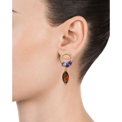 Elegant lady wearing VICEROY JEWELS Mod. 13101E100-39 earrings featuring silver and multicolored gemstones, shown on ear for jewelry showcase.