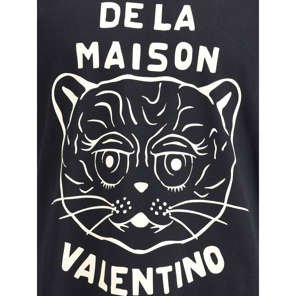 Valentino Black Cotton T-Shirt featuring Le Chat De La Maison graphic on the front, adding distinctive character and casual elegance.