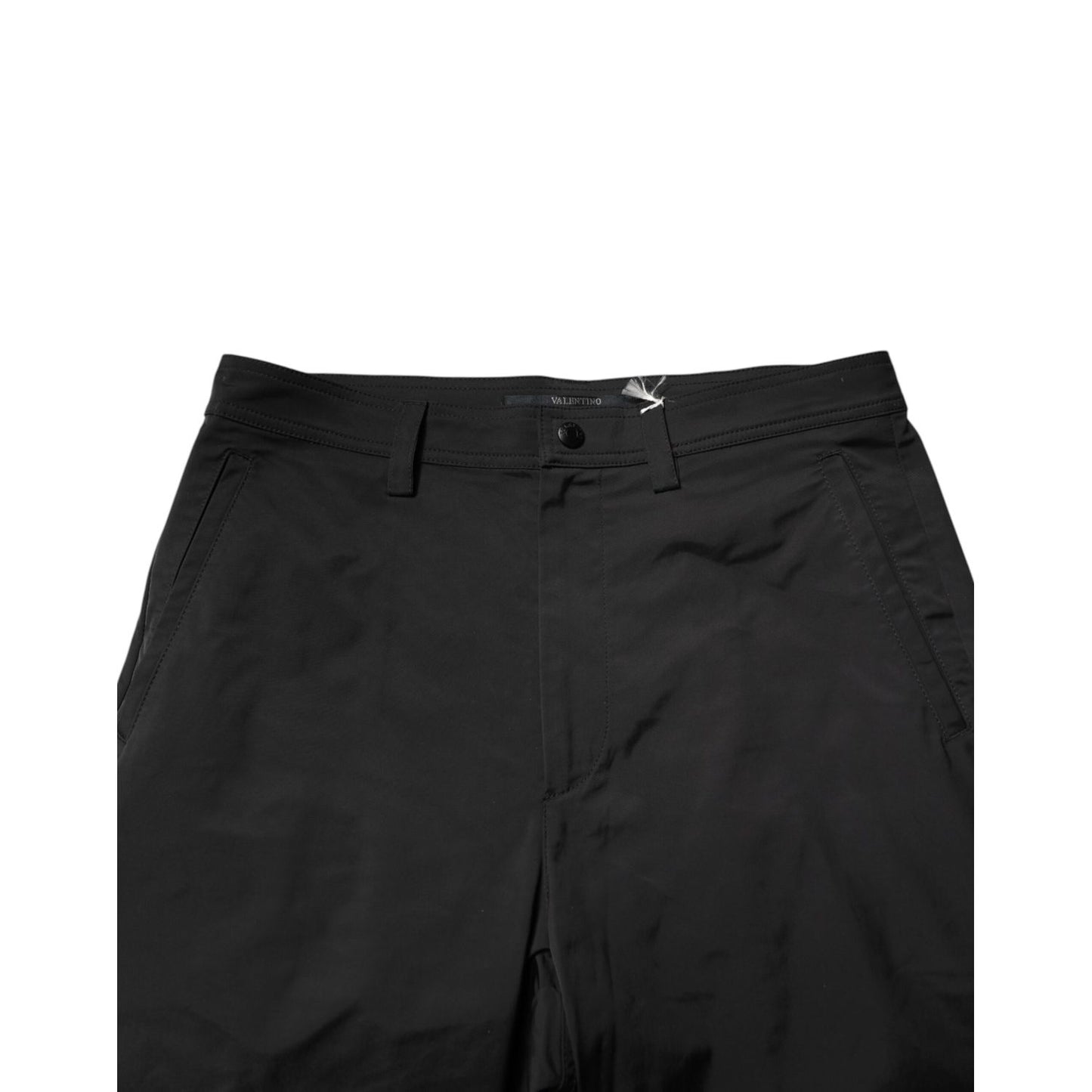 Valentino Black Mid Waist Men Tapered Dress Trouser Pants showcasing sleek design and mid-waist fit.