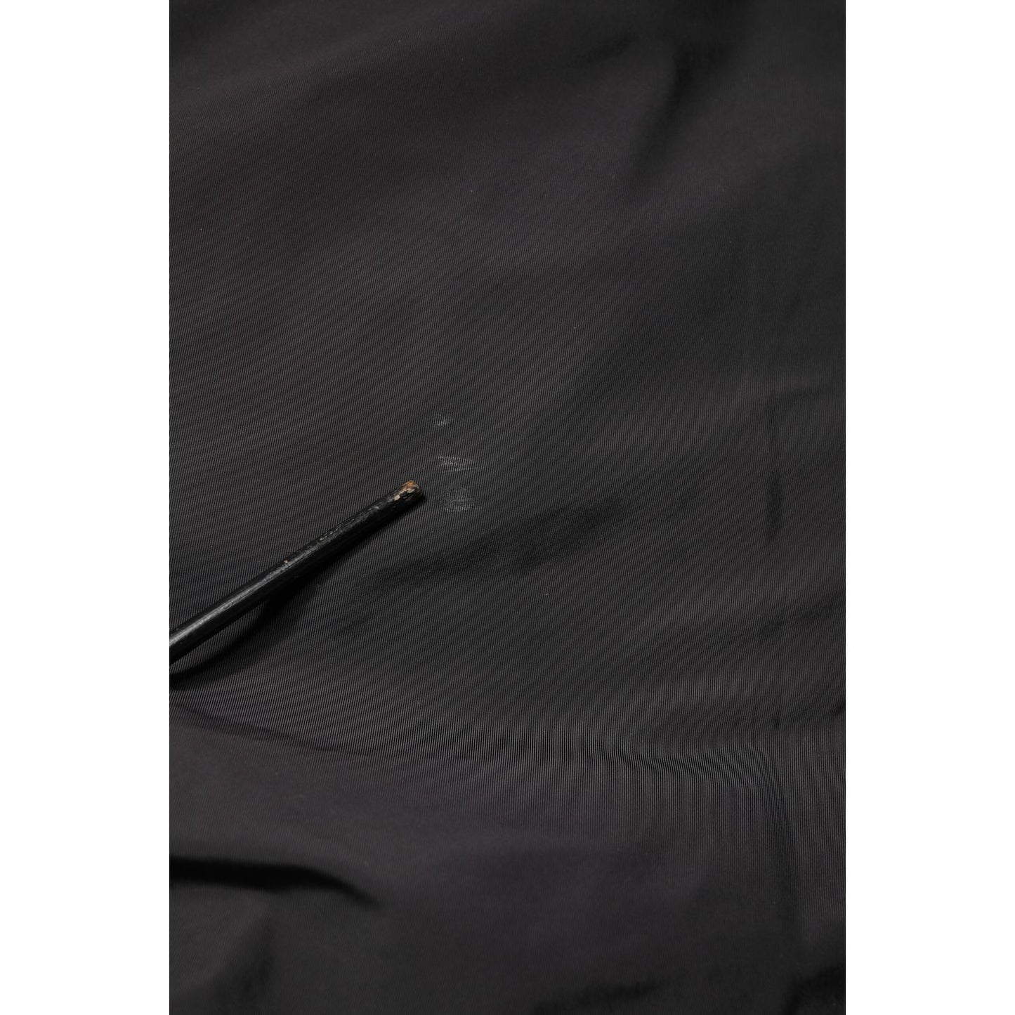 Close-up of Valentino Black Mid Waist Men Tapered Dress Trouser Pants fabric texture.