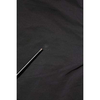 Close-up of Valentino Black Mid Waist Men Tapered Dress Trouser Pants fabric detail.