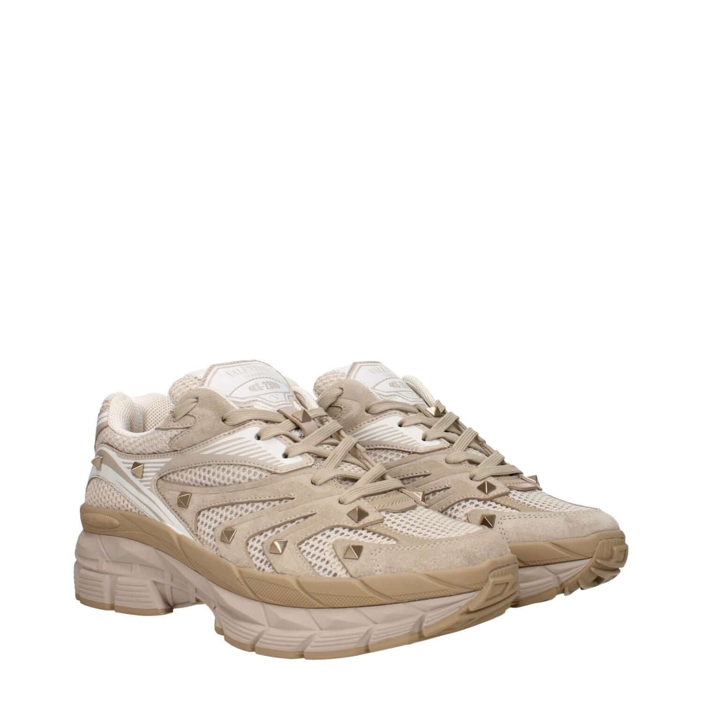 Valentino Garavani Beige Fabric Low Top Sneakers with lace-up closure, rubber sole, and stud details, featuring a front and back logo.