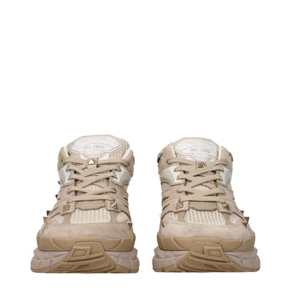 Valentino Garavani Beige Fabric Low Top Sneakers with front and back logos, studs, lace-up closure, and rubber sole. MPN S0F57HTKMXY.