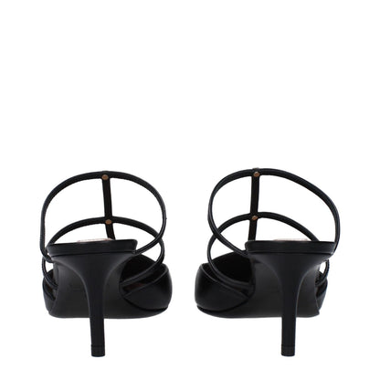 Back view of Valentino Garavani Black Leather Flat Sandals with gold studs and mid heels.