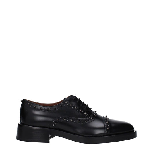 Valentino Garavani Black Leather Oxfords And Derbies with studs; casual style, leather sole, round toe, lace-up and monkstrap.