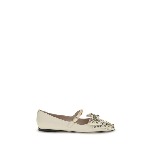 Valentino Garavani Cream Goatskin Ballet Flats with bow, eyelet, and stud detailing, featuring adjustable strap and VLogo brass finish.