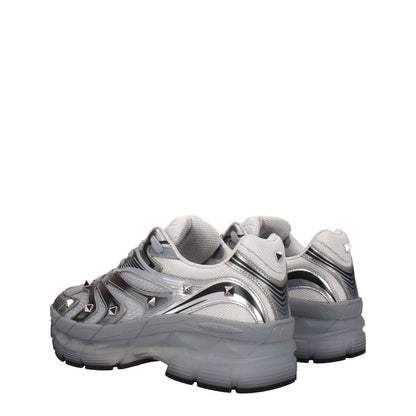 Valentino Garavani Gray Fabric Athletic Sneakers with studs and front logo, lace-up closure, rubber sole, mid heels, and round toe.