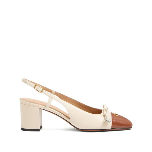 Valentino Garavani Valet Du Roi Goatskin Slingback Pump 60mm with beige buckle fastening, round toe, and block heel