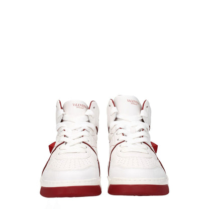 Valentino Garavani White Leather High Top Sneakers with red accents, lace-up closure, and round toe, featuring front and side logos.