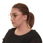 Woman wearing Yohji Yamamoto Gold Women Glasses Frame, full-rim butterfly style with metal frame, shown from side with demo lenses.