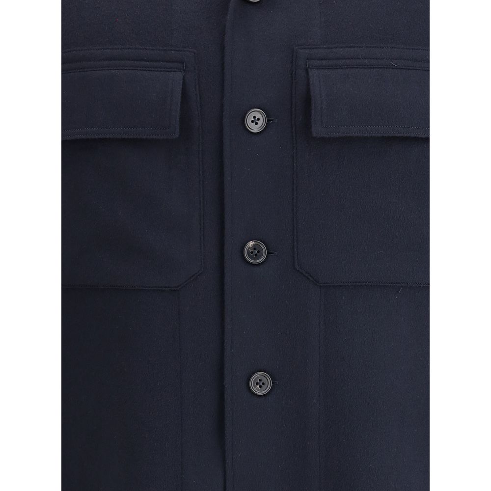 Close-up of button details on ZEGNA Blue Cashmere Coat with flap pockets.